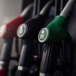 A bright photography of guns with various colours. Modern refueling station. No people.